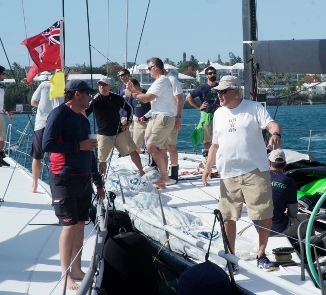 Hap Fauth, owner/driver of Bella Mente, congratulates George Sakellaris, owner of Shockwave upon arrival at the Royal Bermuda Yacht Club. (Photo Credit: Barry Pickthall/PPL)